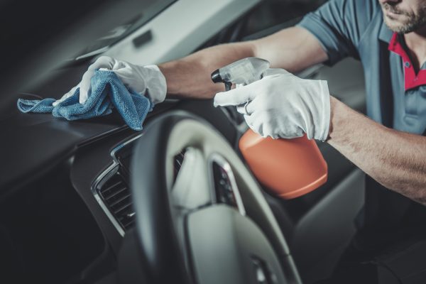 Automotive Maintenance Theme. Car Interior Dashboard and Cockpit Disinfection and Detailed Cleaning. Clean and Sanitized Vehicle.